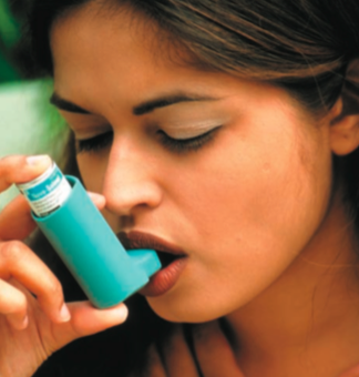 Girl using inhaler